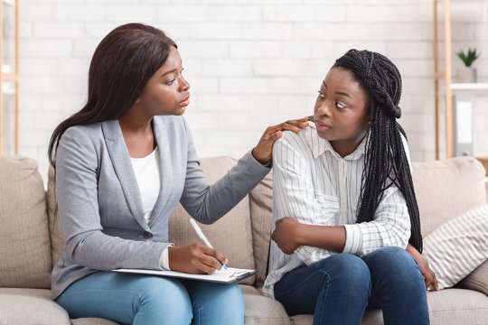 Counselor offering comfort to client