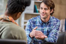Counselor talking with a client