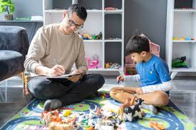 Therapist helping child build skills